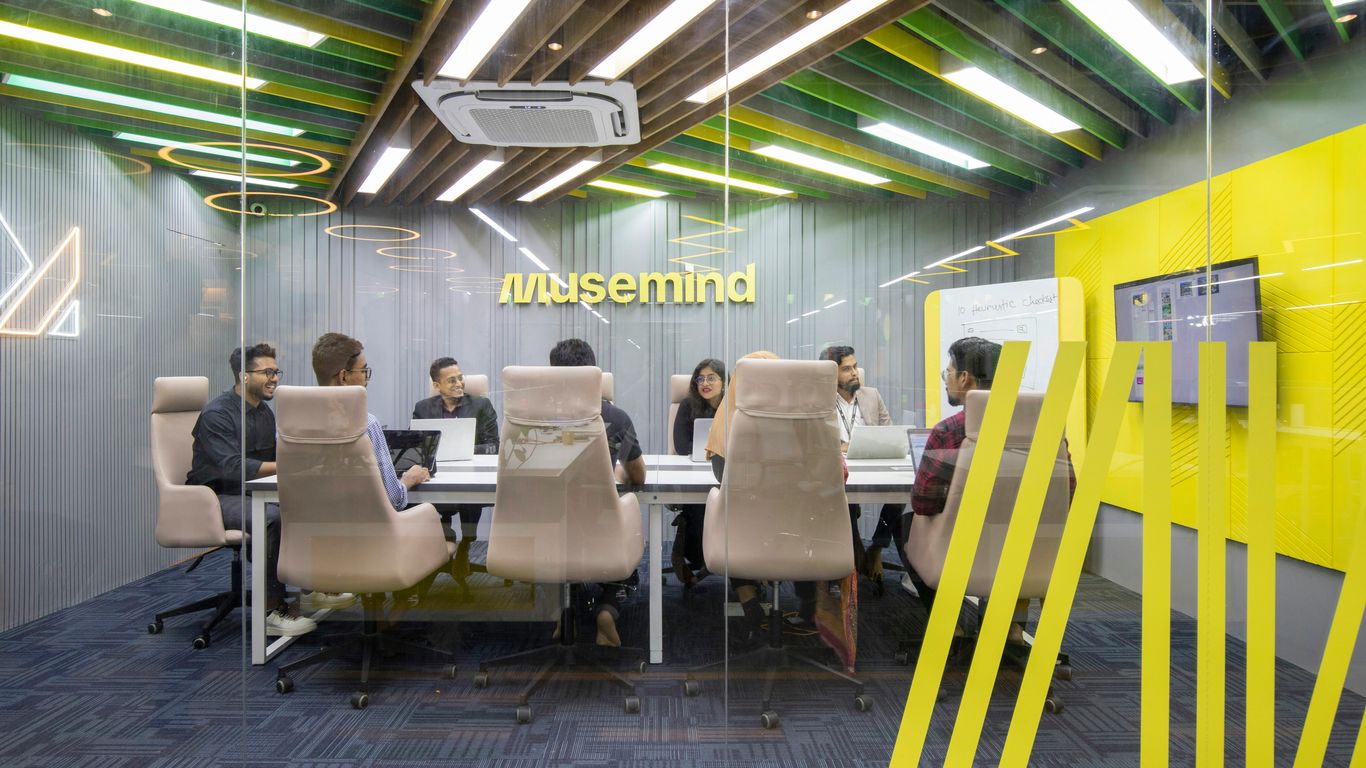 a group of people sitting around a table