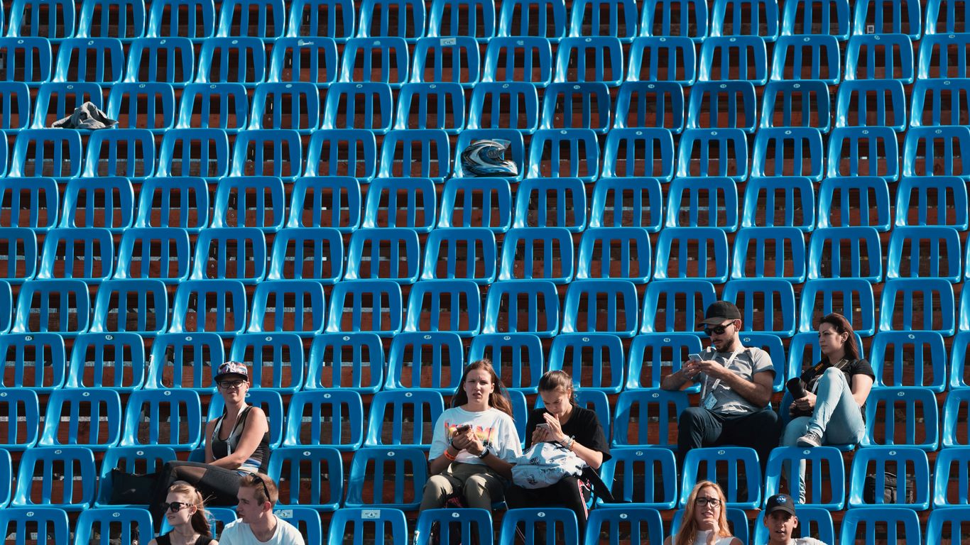 group of people sitting on blue gang chair