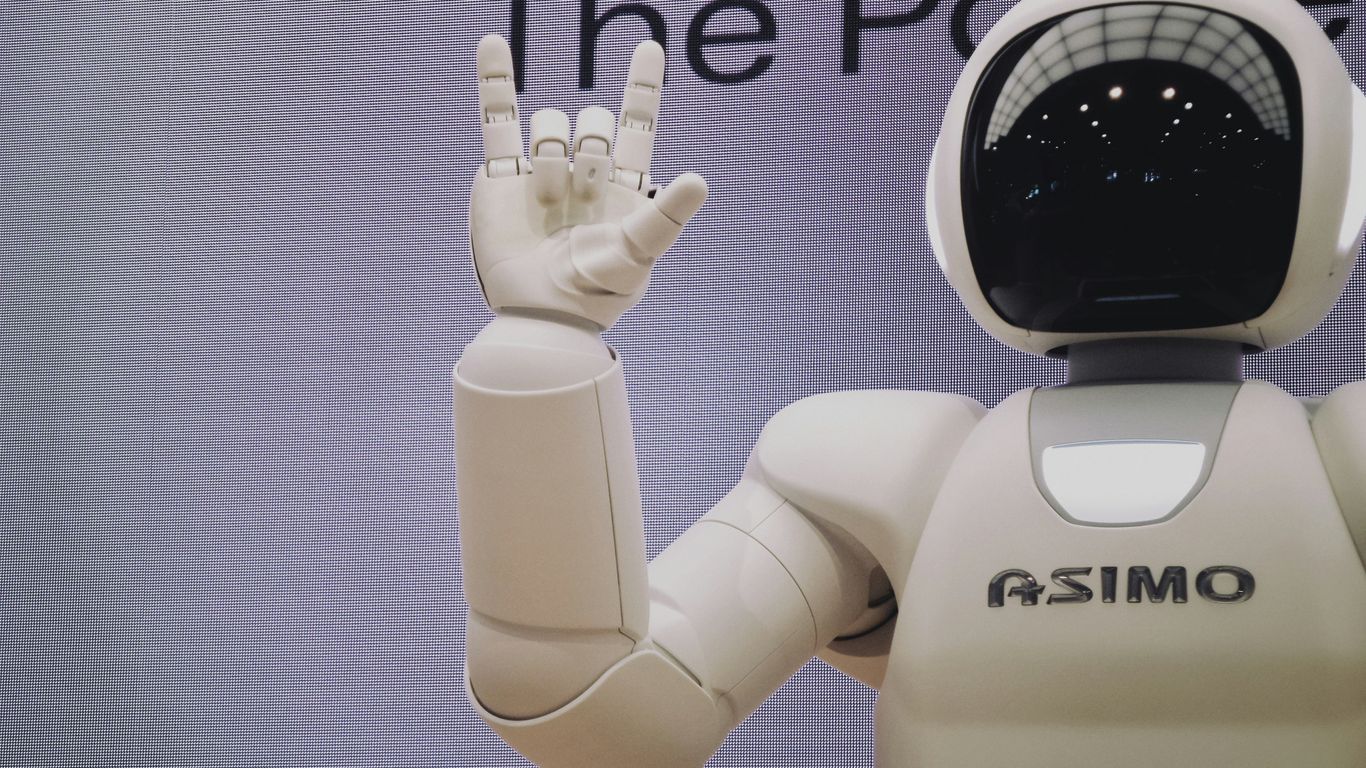 Asimo robot doing handsign