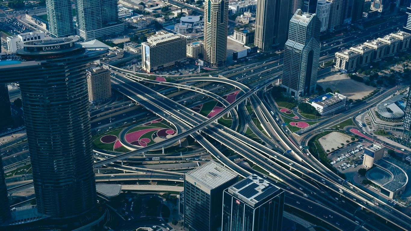 an aerial view of a highway intersection in a city