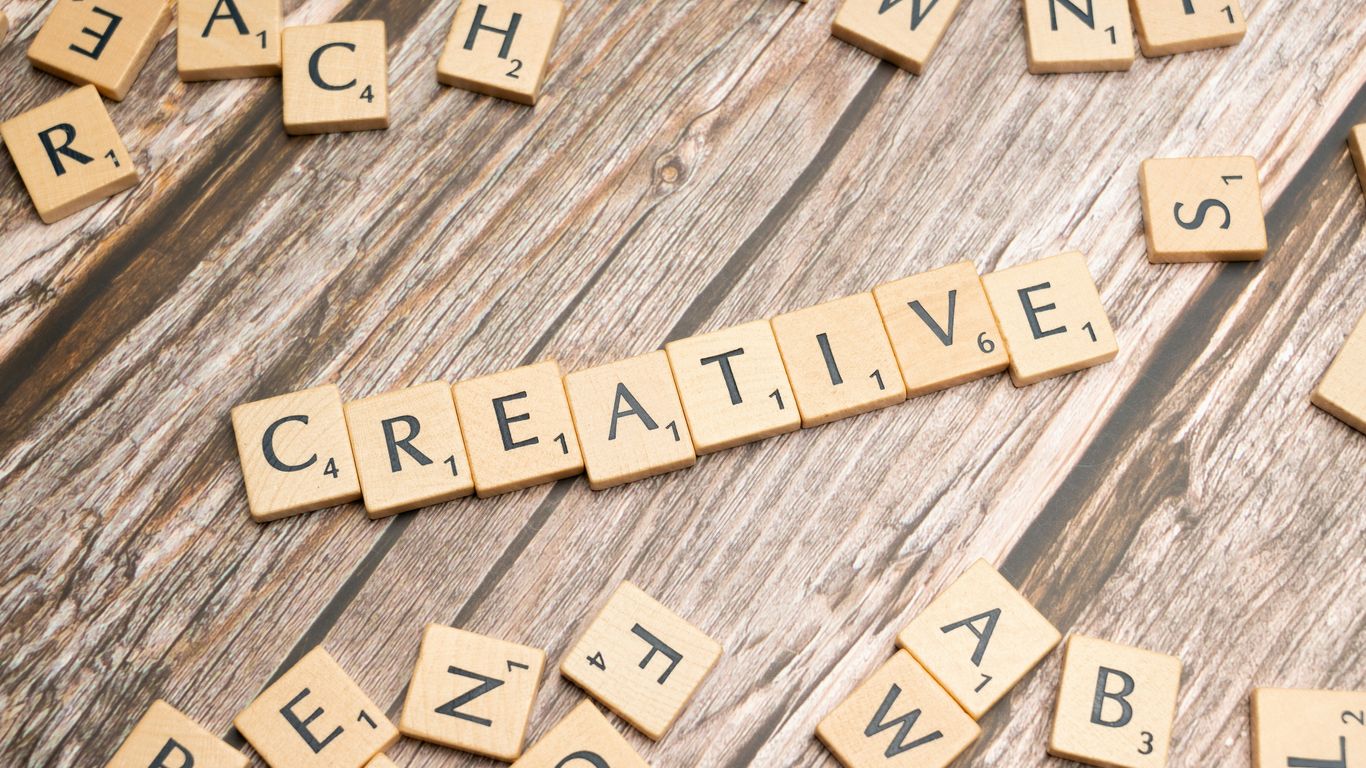 scrabble tiles spelling out the word creative
