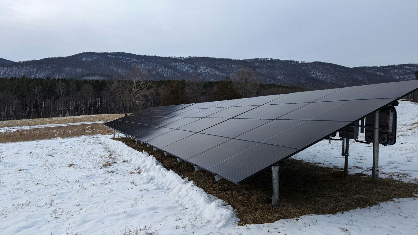 a solar panel in the middle of a snowy field
