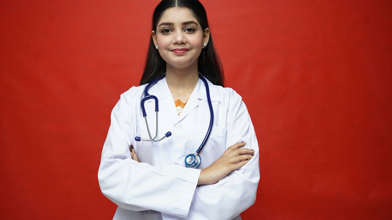 a woman in a white coat