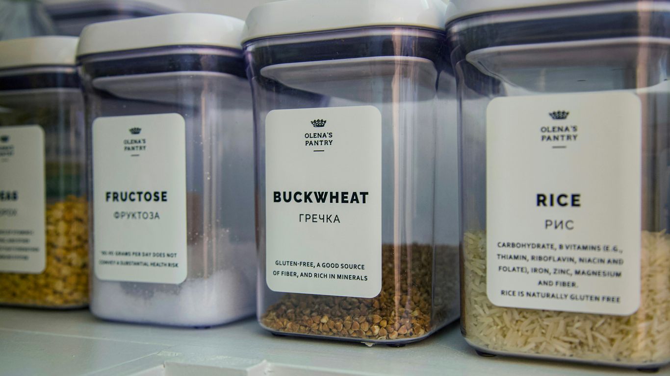 2 clear glass jars on white shelf