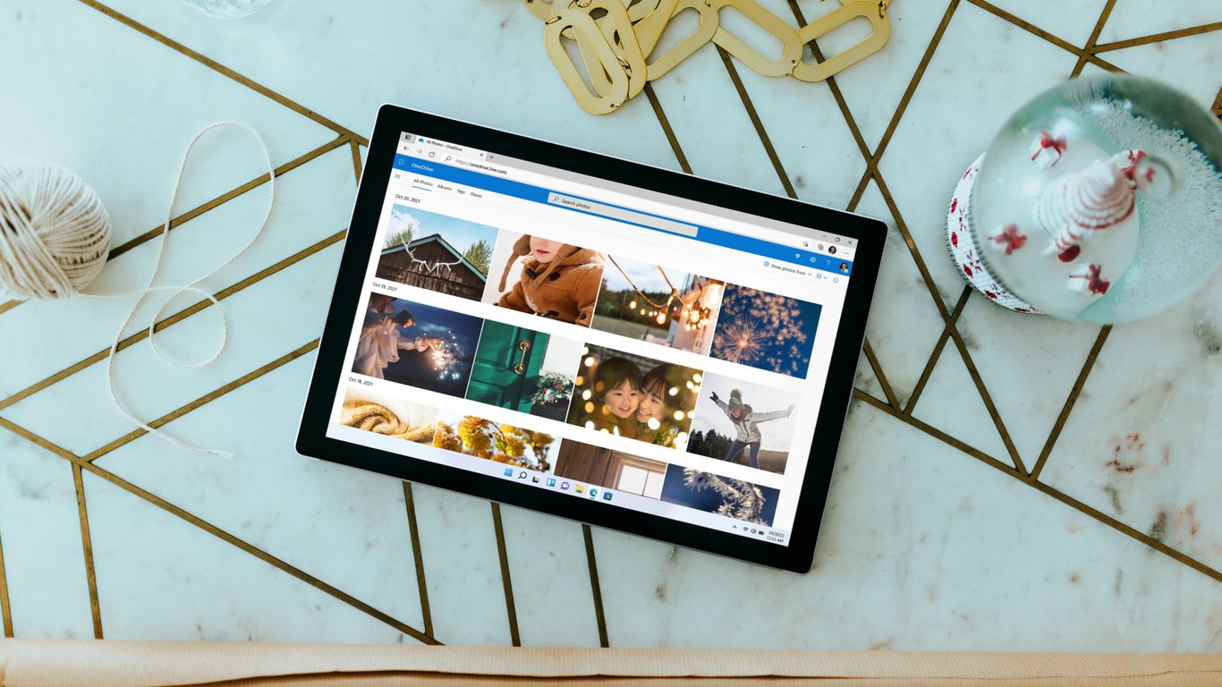 Surface Laptop on table with Christmas decorations surrounding 