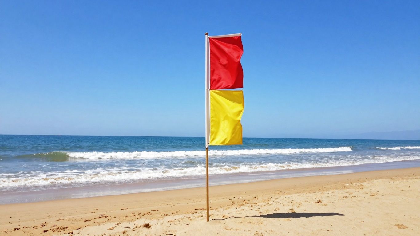 Rood-gele vlag op een zonnig strand.
