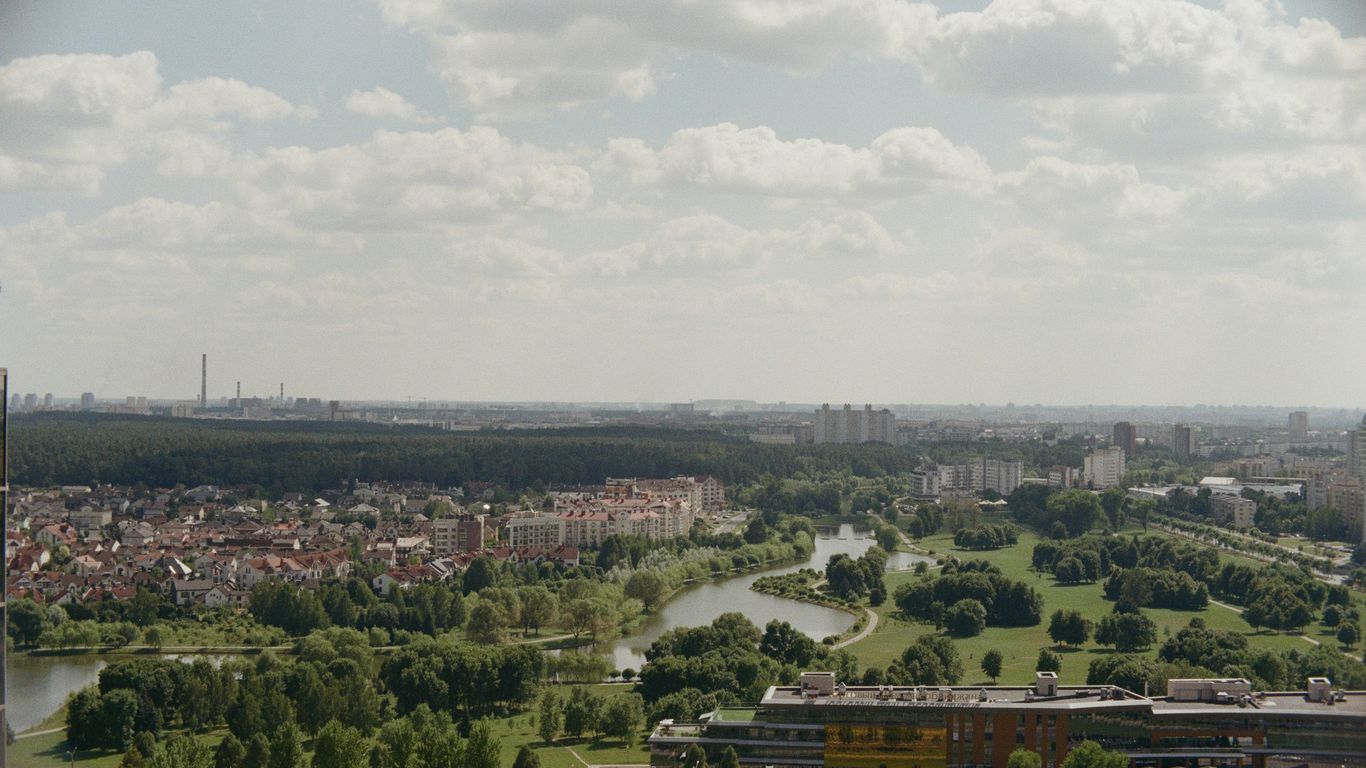 an aerial view of a city with a river running through it