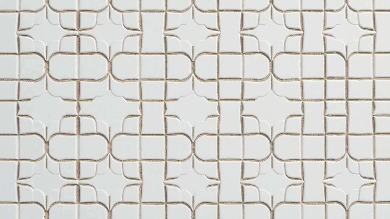 White Arabesque tiles with intricate geometric patterns.