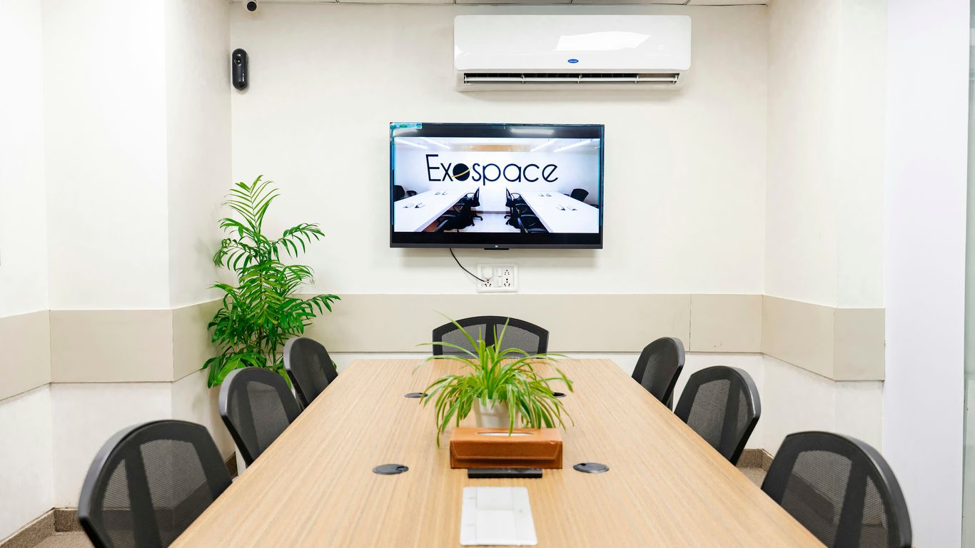 A modern conference room with a tv.
