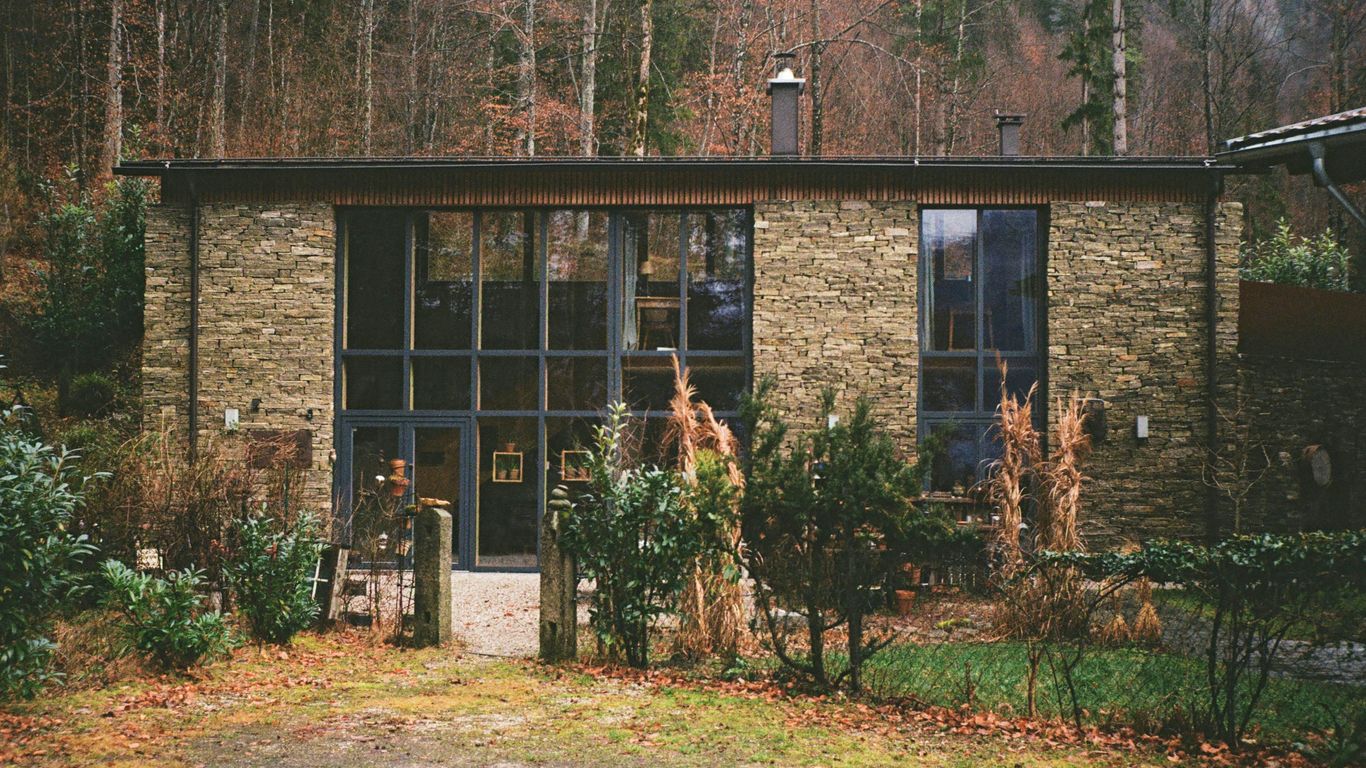 a brick building with a large glass window
