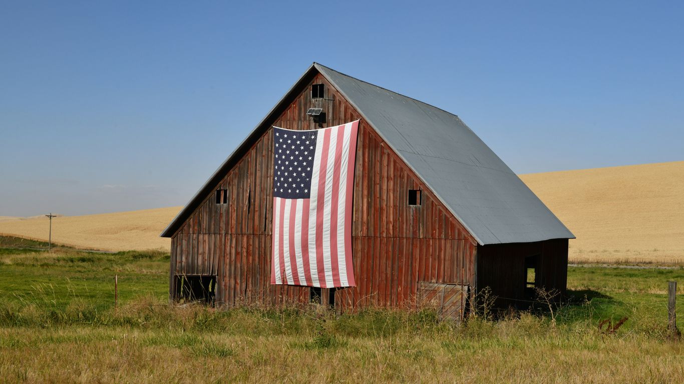 red and white barn house under blue sky during daytime