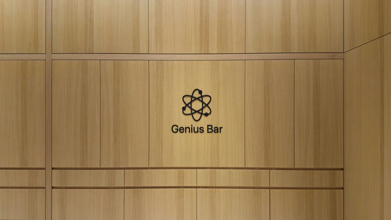Genius bar logo on a light wood paneled wall