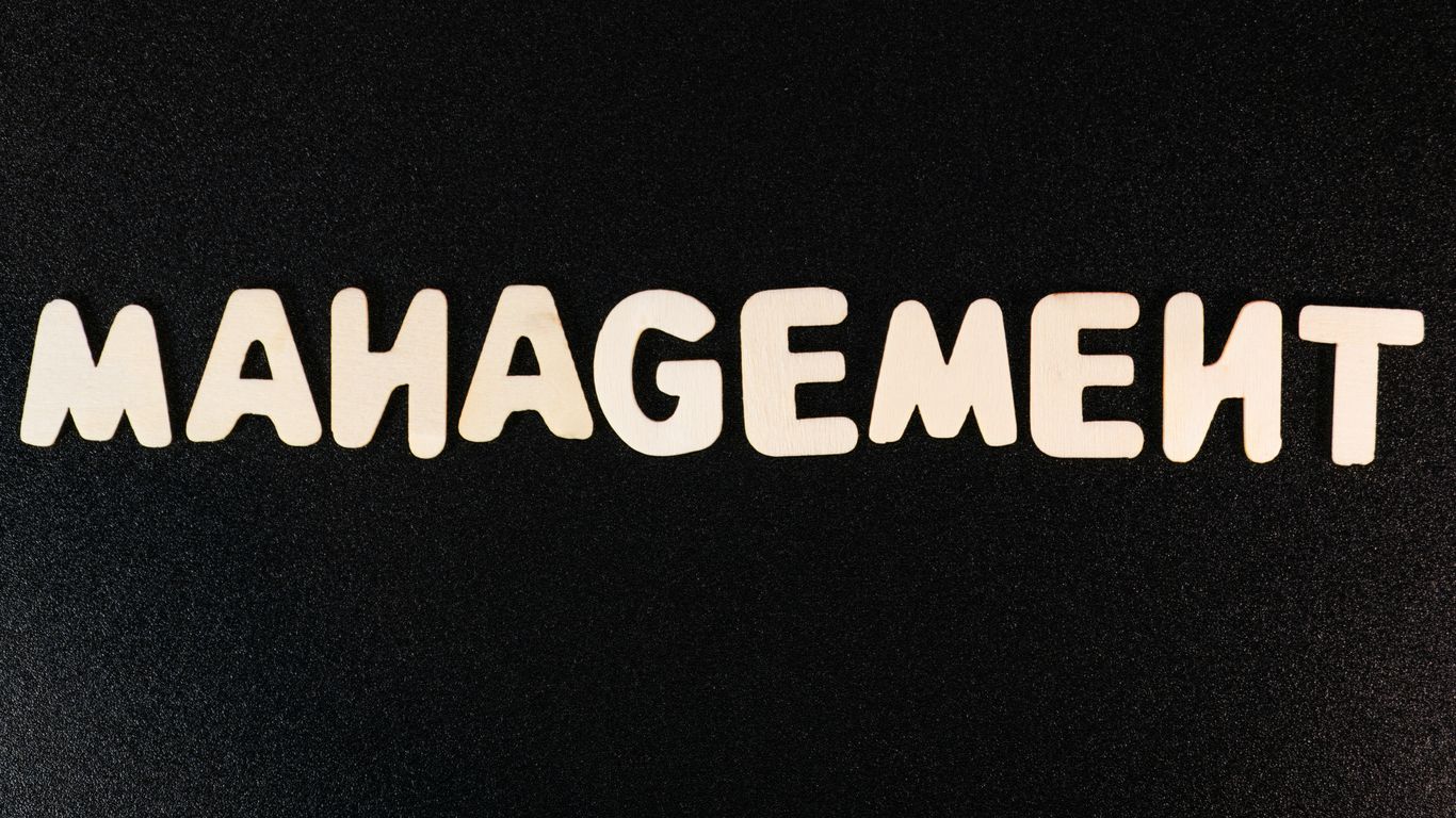 the word management written in white letters on a black background