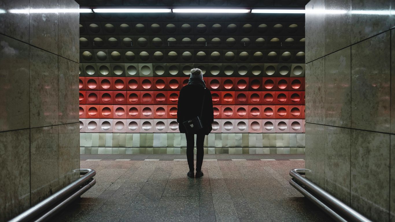 person standing on train station
