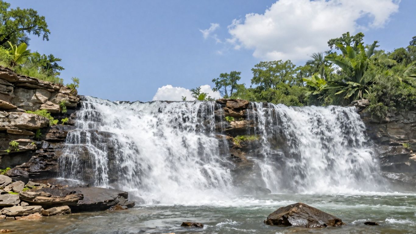 Cascading waterfall over layered rocks at Pedernales Falls State Park.