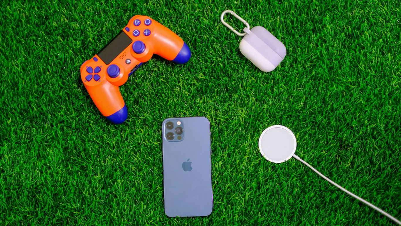 silver iphone 6 beside orange and blue game controller