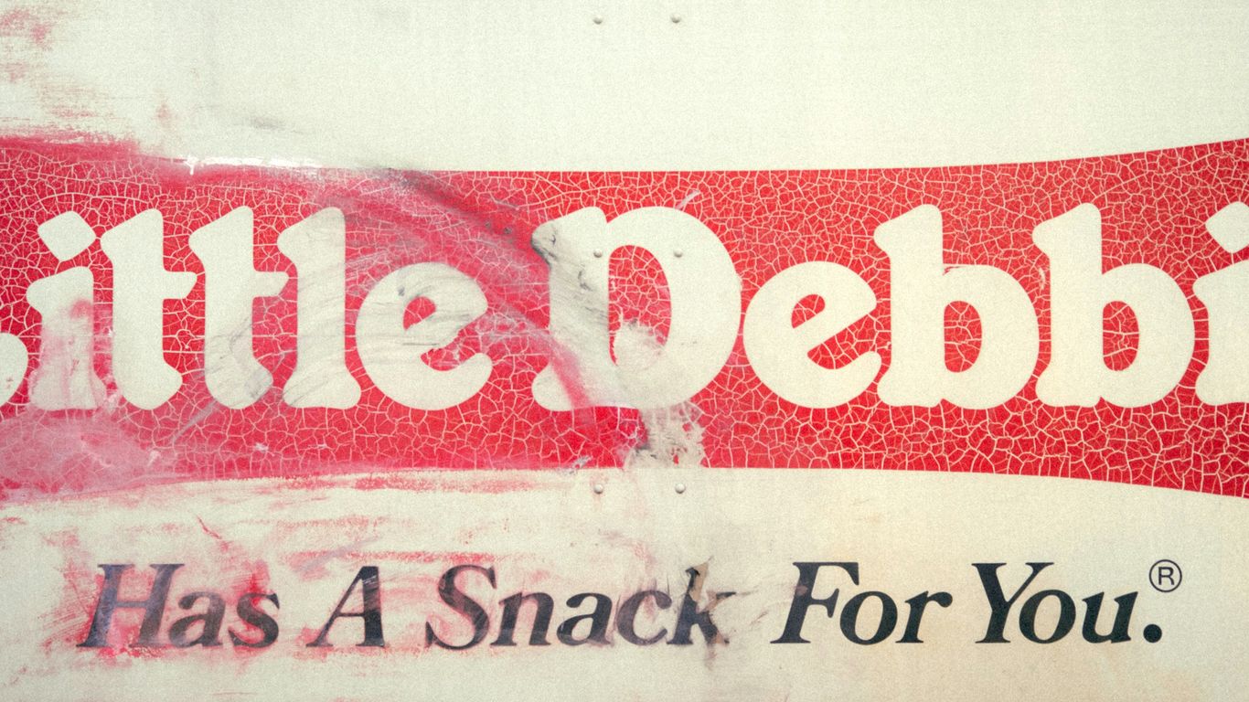 a red and white sign that says little pebble has a snack for you