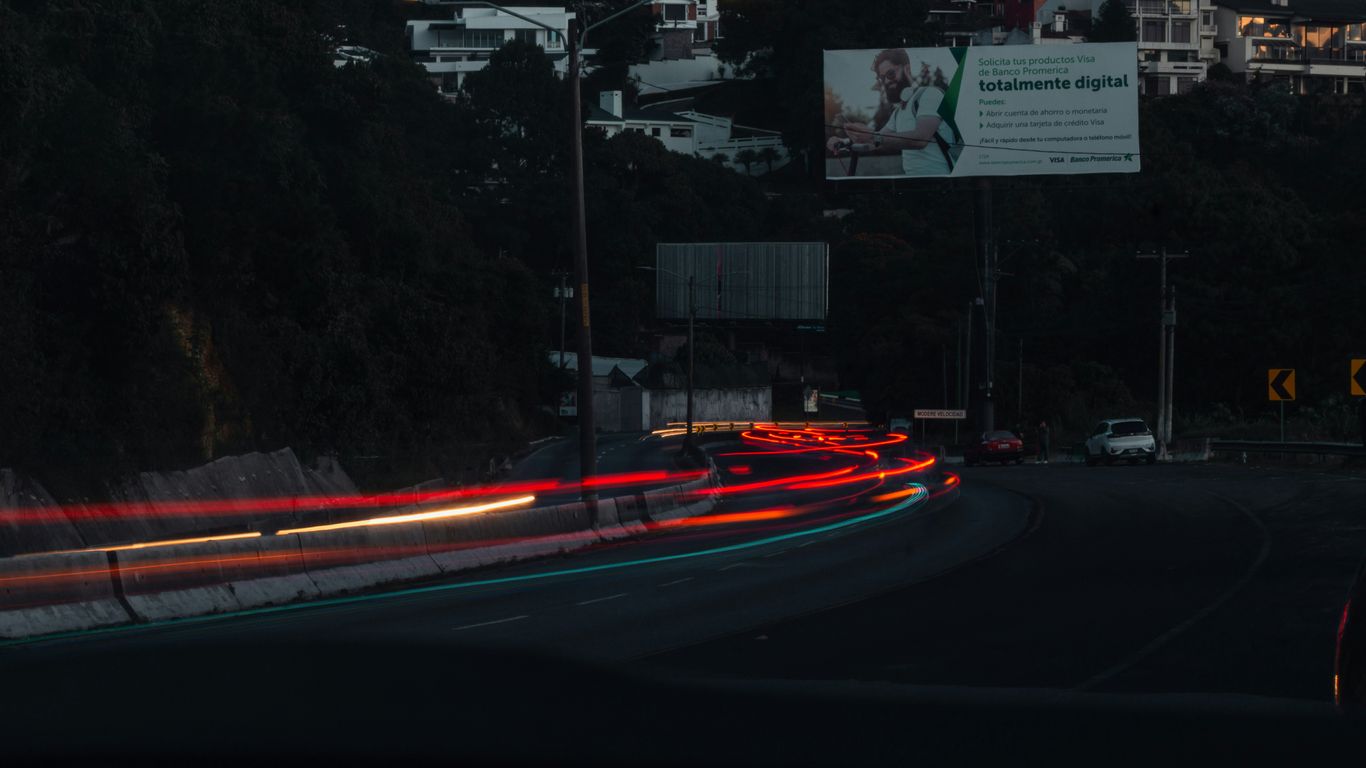 a blurry photo of a city street at night