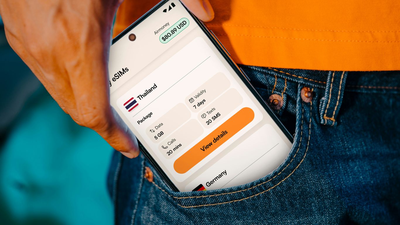 Smartphone displaying travel information in a pocket.