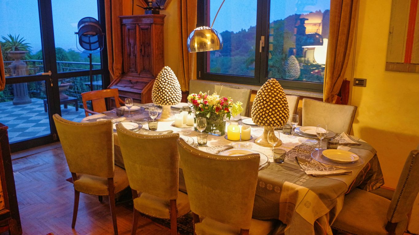 A dining room with a table and chairs