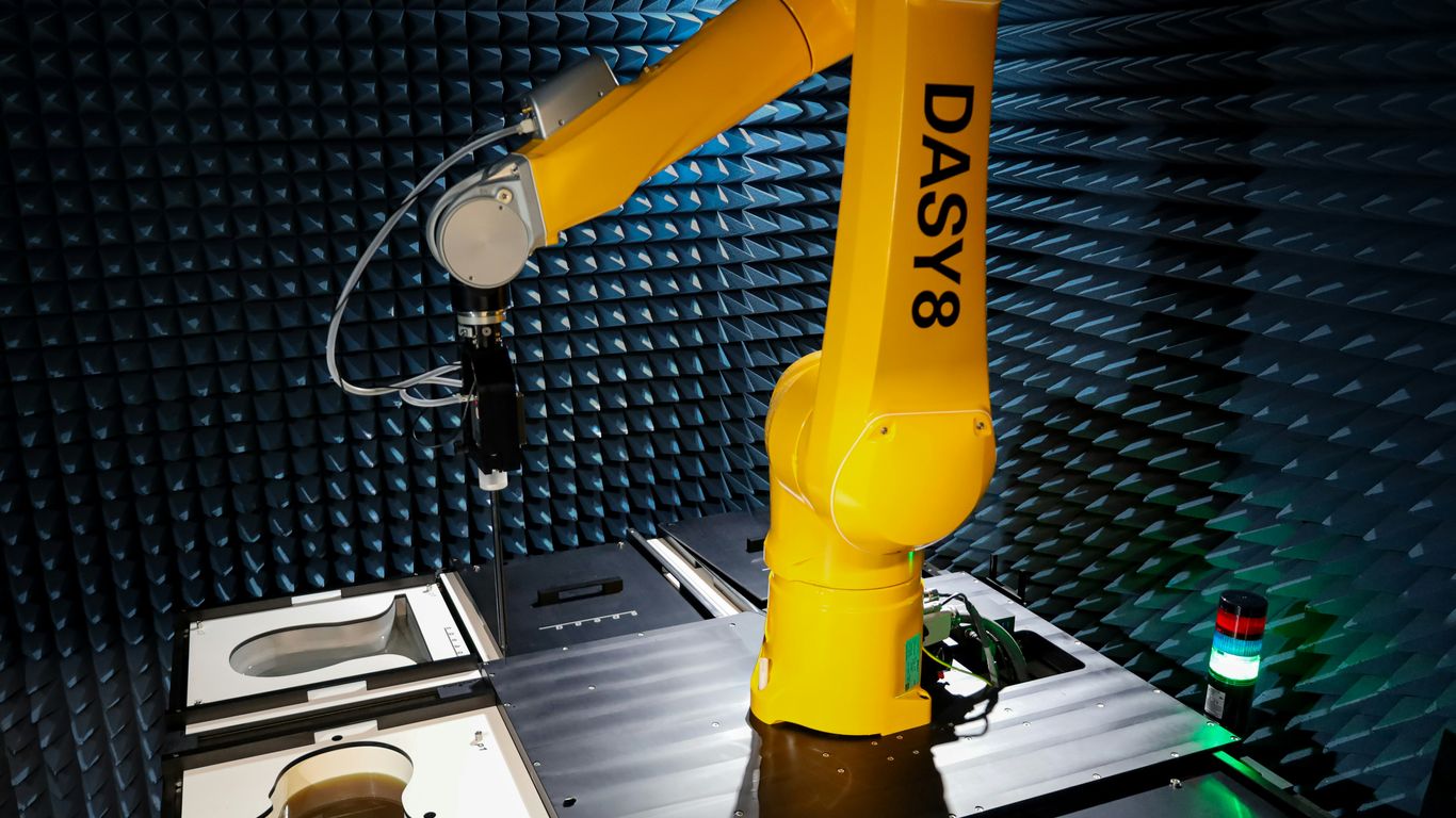 a yellow robot sitting on top of a table