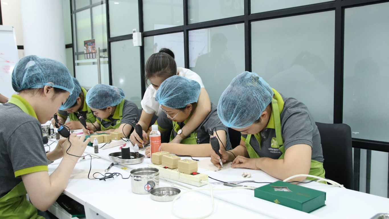 A group of people working on something on a table