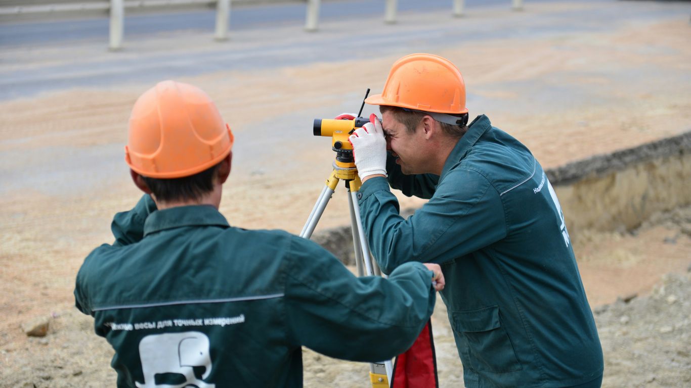 a couple of men standing next to each other
