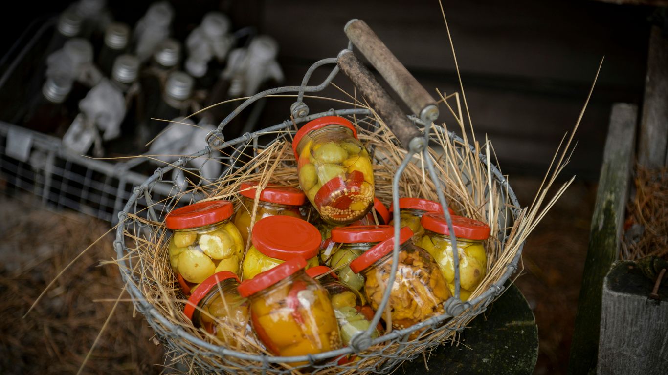 Basket of apples with straw and blurred background