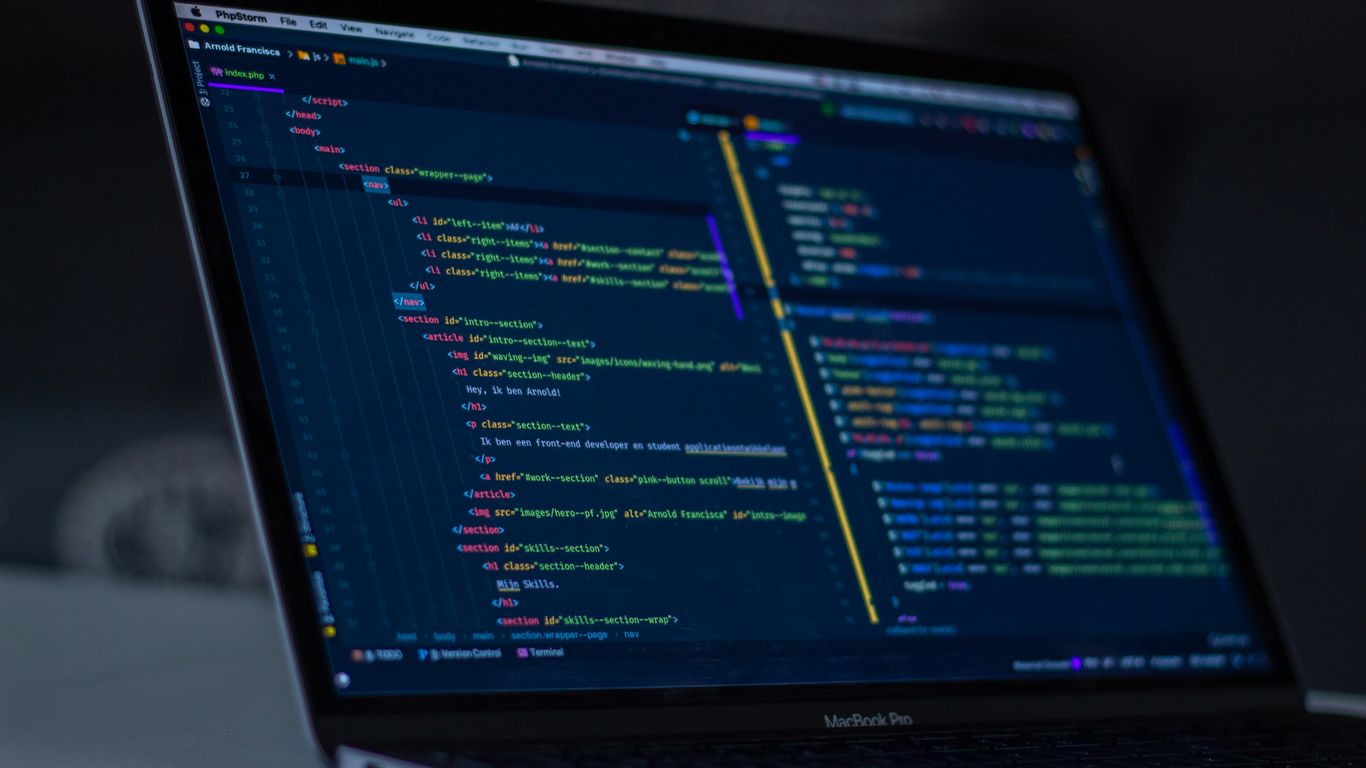 turned-on MacBook Pro wit programming codes display