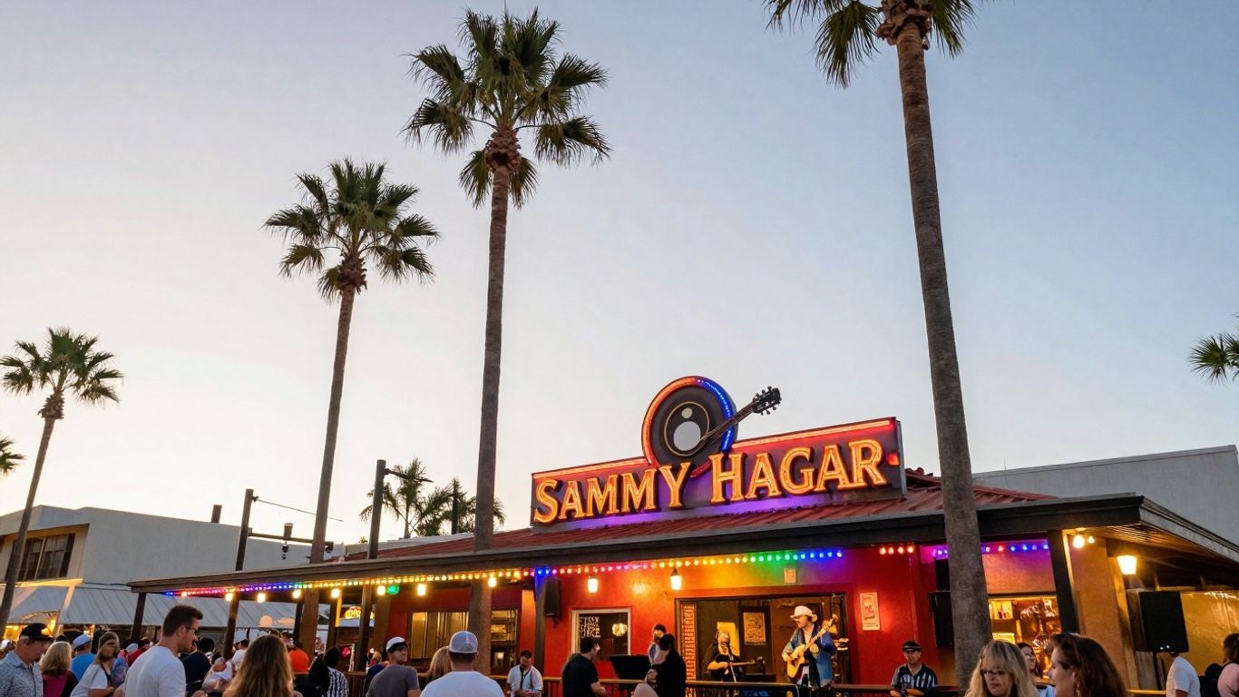 Cabo Wabo Cantina exterior at dusk with palm trees and lights.