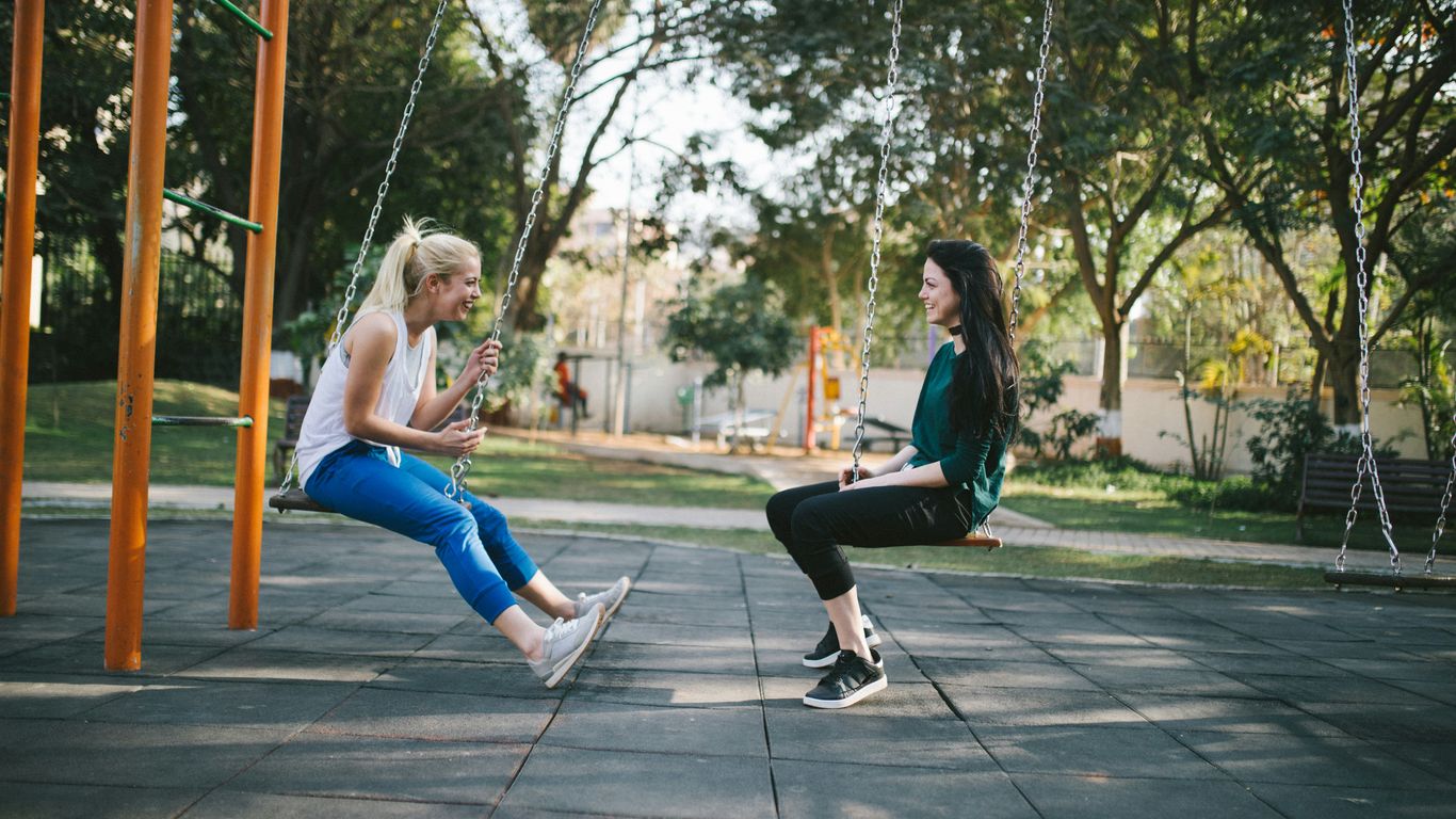 woman sitting on swing