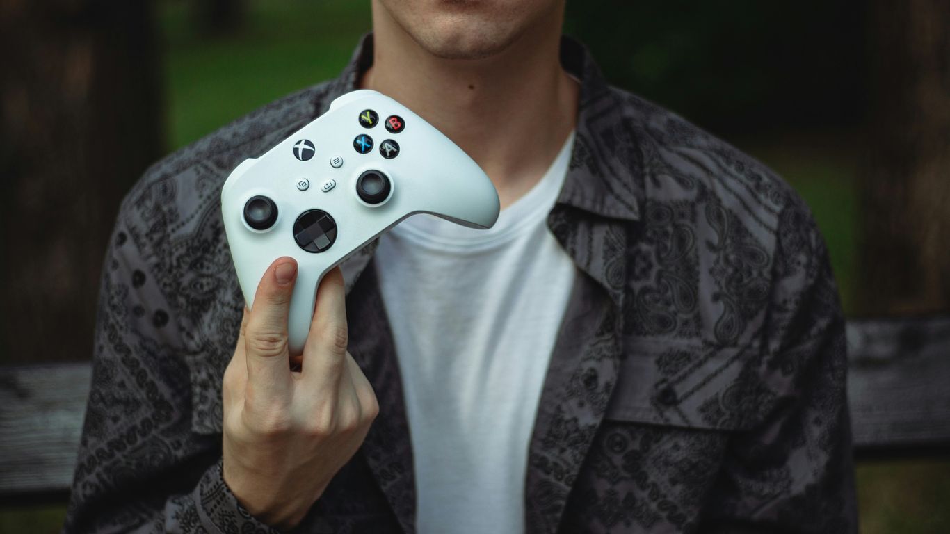 a person holding a video game controller