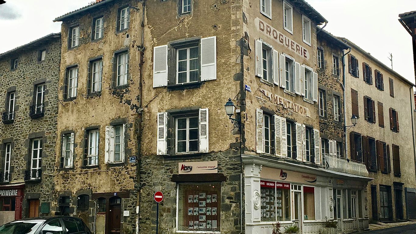 black SUV parked behind house