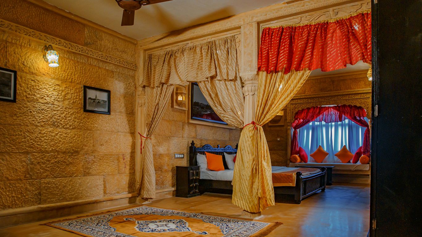 a bedroom with a bed and a fan