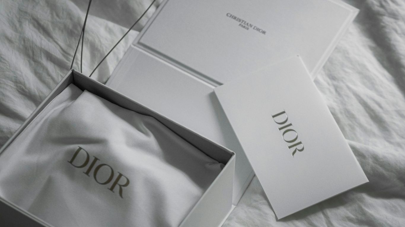 Dior gift box with branded packaging and informational cards.