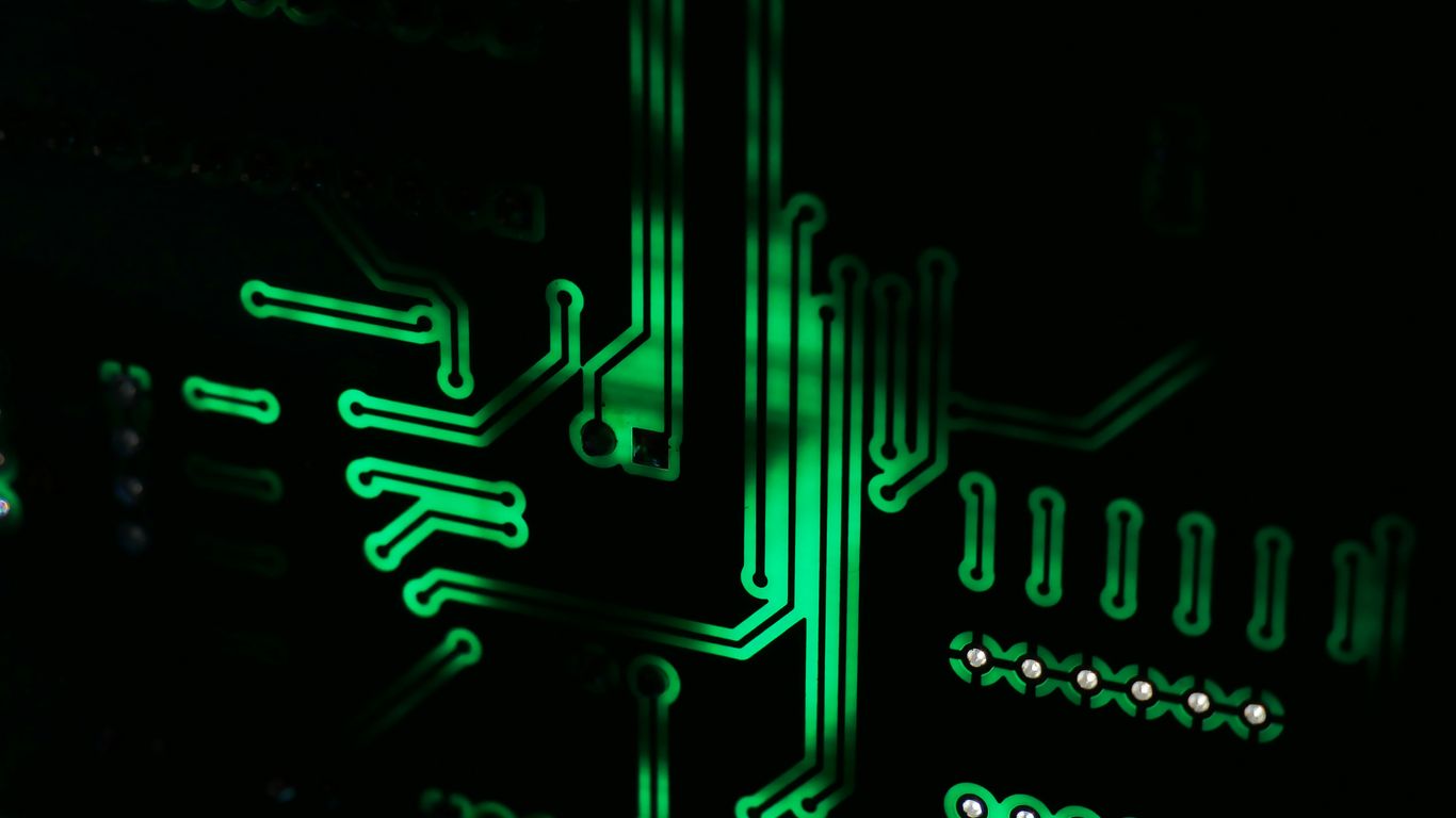 a close up of a computer motherboard in the dark