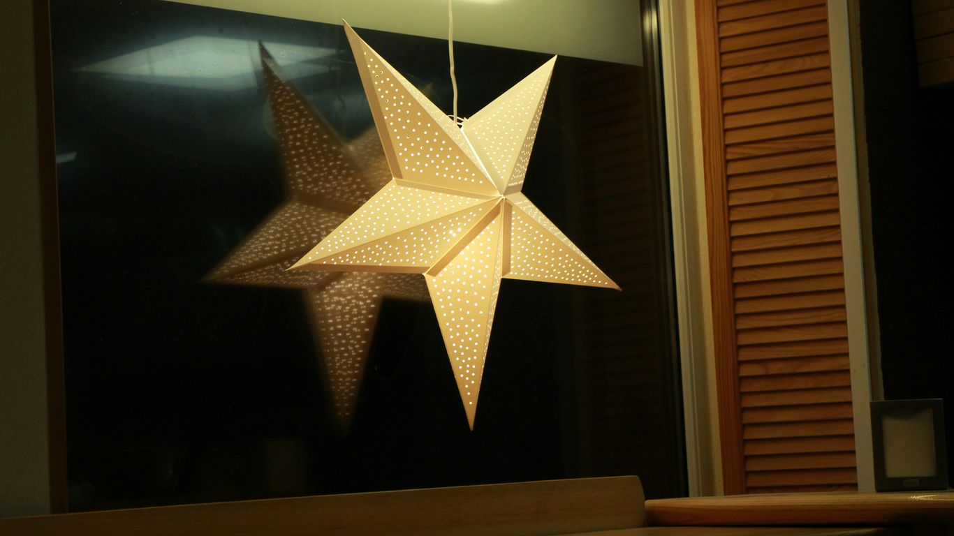 gold star ornament on brown wooden table