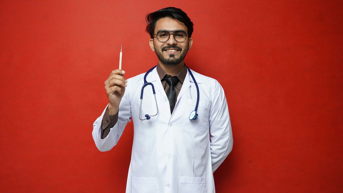 a doctor holding a syringe