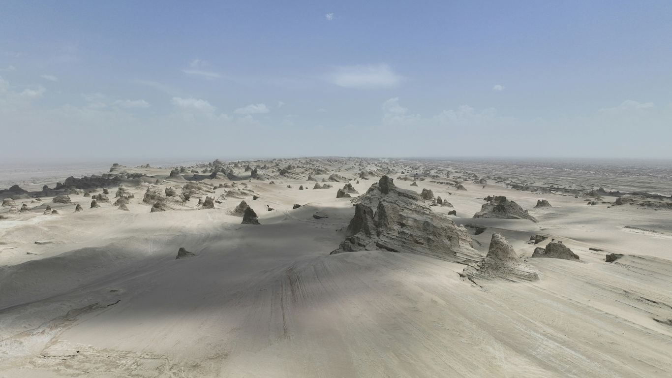 Desert landscape with strange rock formations under a clear sky