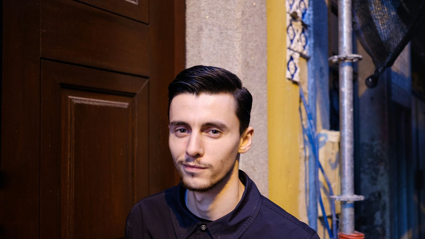 man standing beside door