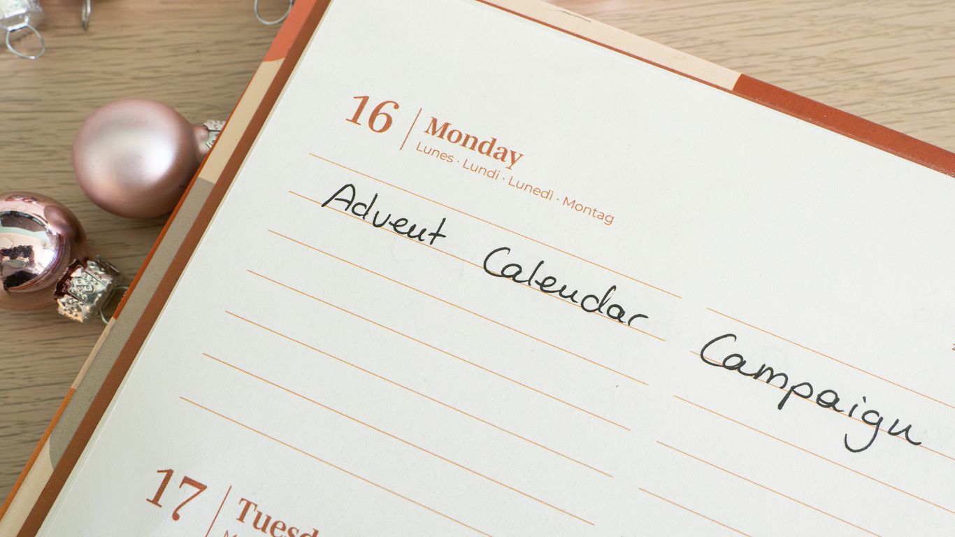 a table with a calendar and ornaments on it