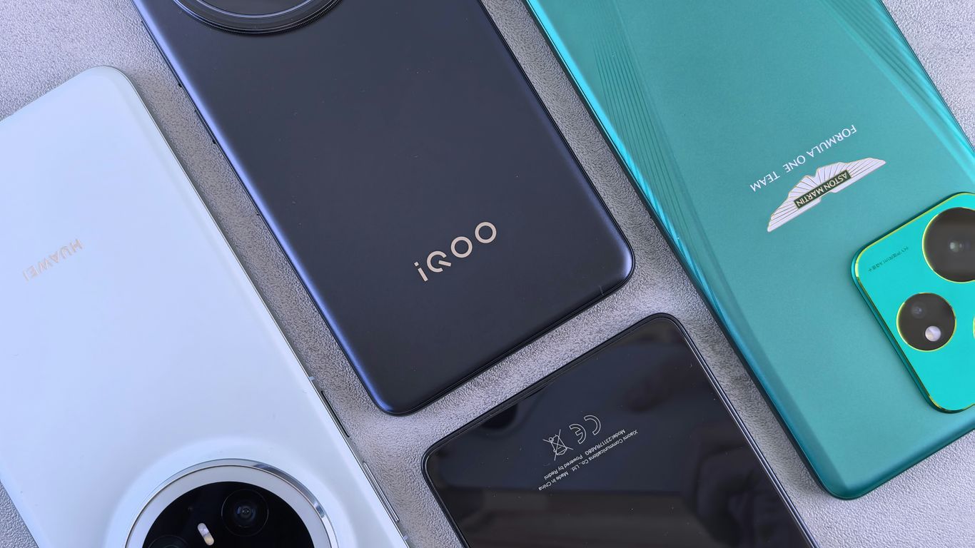 Several modern smartphones are laid out.