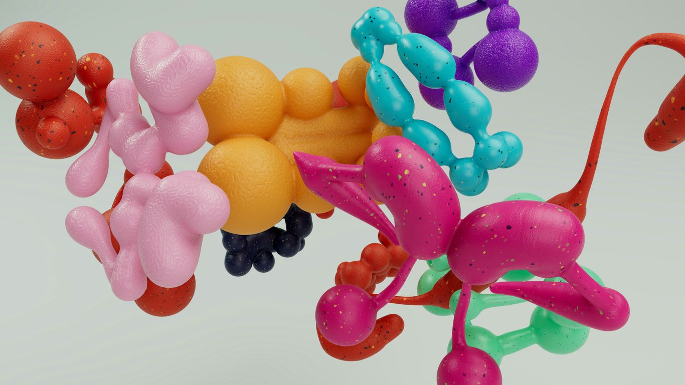 A bunch of different colored balloons in a vase