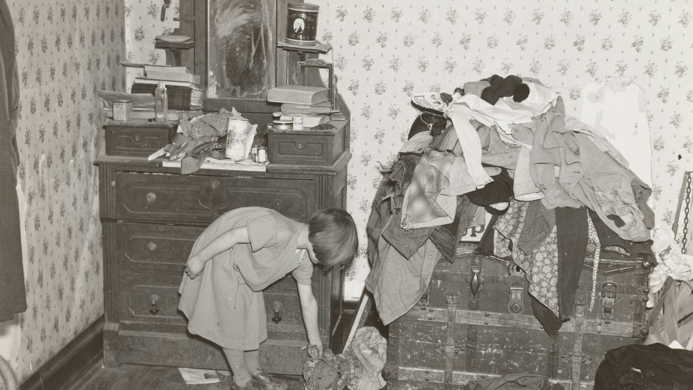 girl beside vanity dresser and clothes
