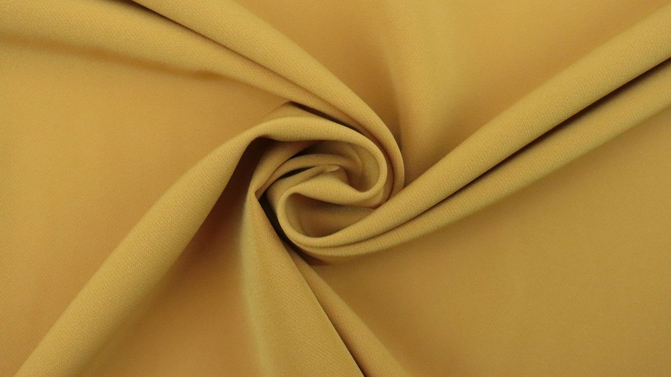 a close up view of a plain yellow fabric