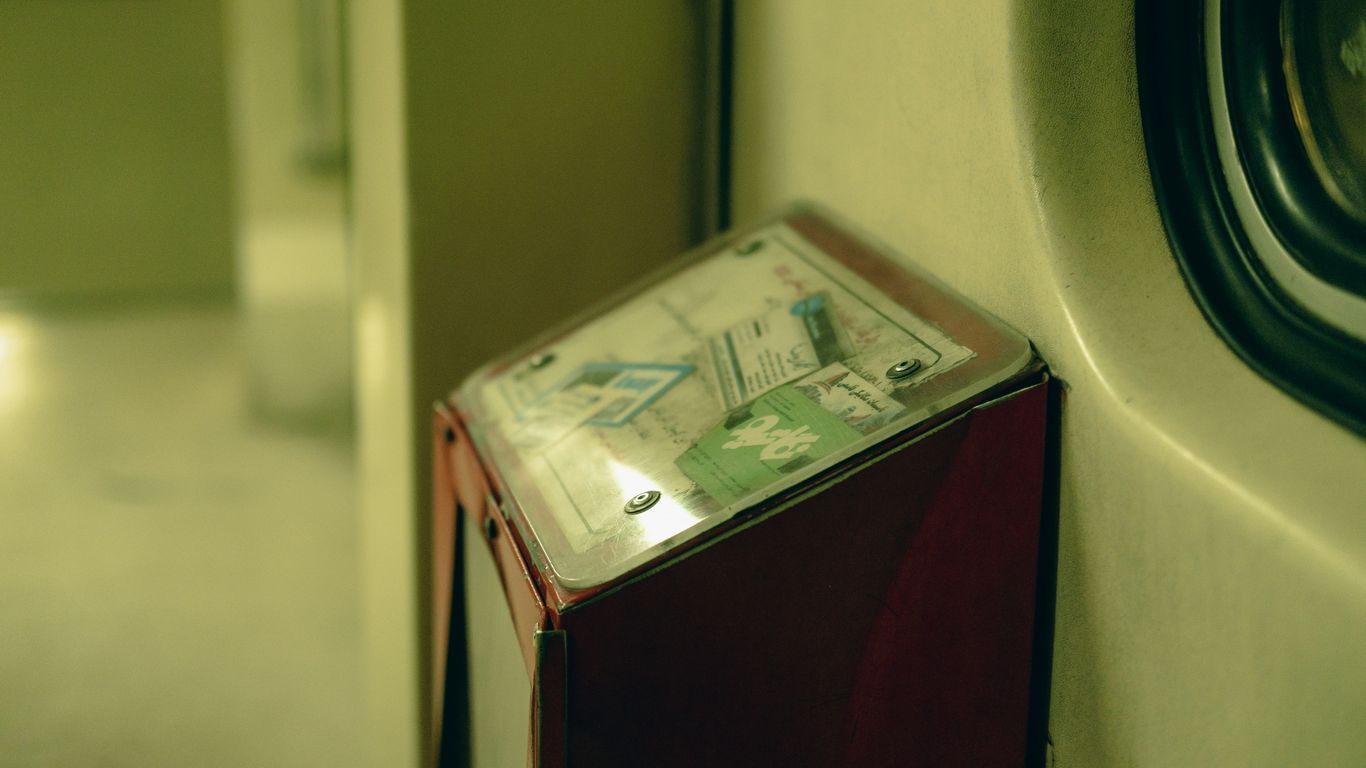 a red refrigerator freezer sitting next to a dryer