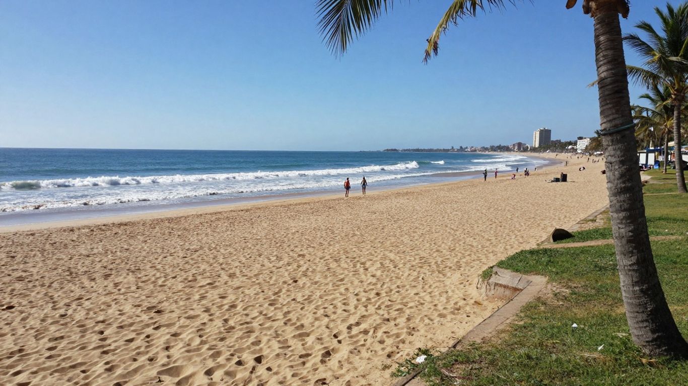 Golden sandy beach with families and blue Atlantic Ocean.