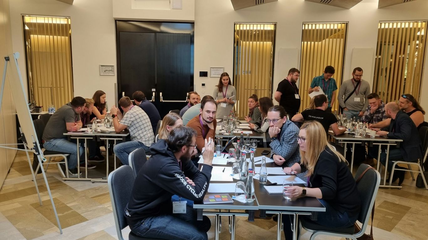 a group of people sitting around a table