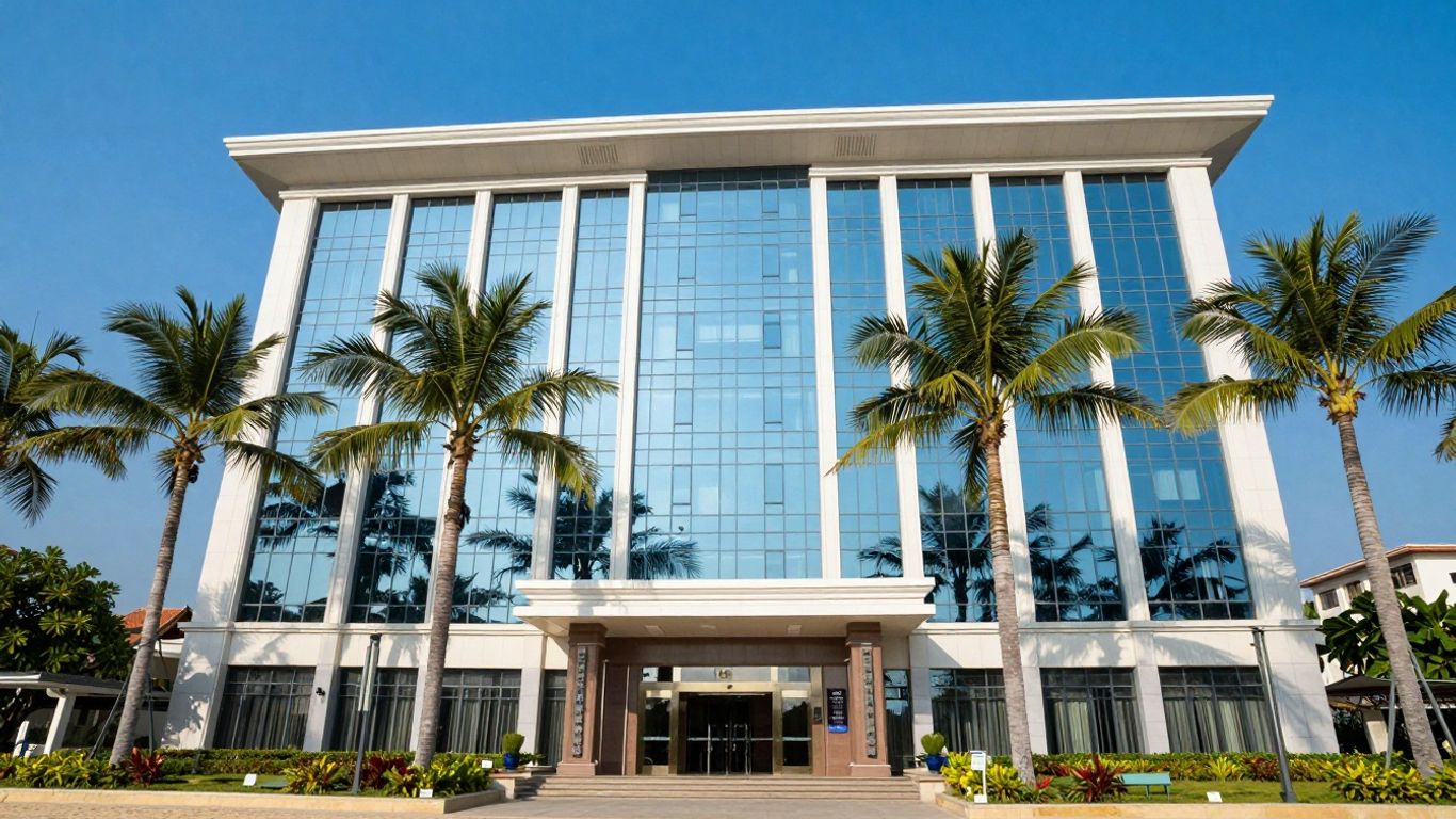 Phuket bank building with palm trees and blue sky.