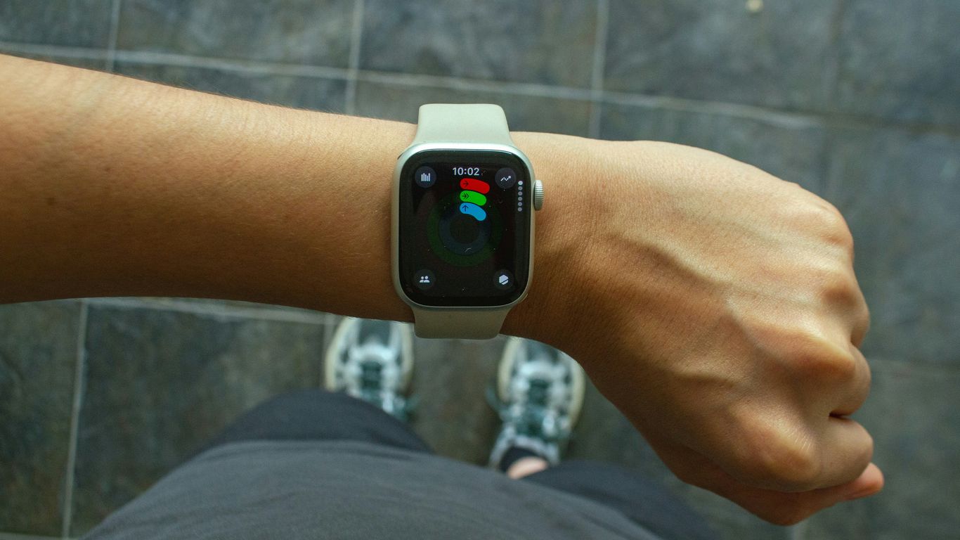 A wrist with an apple watch.
